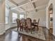 Elegant dining room with coffered ceilings, large windows, and ample seating at 1510 Silver Mist Cir, Powder Springs, GA 30127