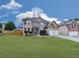 Charming two-story home featuring a well-manicured lawn, brick accents, and a two-car garage at 1510 Silver Mist Cir, Powder Springs, GA 30127