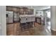 Modern kitchen featuring stainless steel appliances, dark cabinets, and a breakfast bar at 1510 Silver Mist Cir, Powder Springs, GA 30127