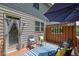 Back deck with outdoor seating, privacy screen, and a door leading to the home's interior at 2333 White Oak Se Bnd, Smyrna, GA 30080