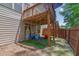 Covered patio with fenced yard featuring a play area for children to enjoy at 2333 White Oak Se Bnd, Smyrna, GA 30080