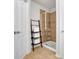Bright bathroom features a glass shower with tiled walls and a decorative towel ladder at 2333 White Oak Se Bnd, Smyrna, GA 30080