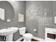 Powder room with modern fixtures, vanity, and decorative wallpaper at 2333 White Oak Se Bnd, Smyrna, GA 30080
