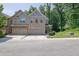 Charming townhome with a two-car garage, brick accents, and a well-manicured front lawn at 2333 White Oak Se Bnd, Smyrna, GA 30080