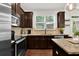 Beautiful kitchen with stainless steel appliances, granite counters and a window over the sink at 2333 White Oak Se Bnd, Smyrna, GA 30080