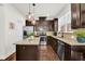 Well-appointed kitchen with granite counters, stainless steel appliances, and rich dark cabinets at 2333 White Oak Se Bnd, Smyrna, GA 30080