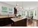Gourmet kitchen with center island, granite countertops, pendant lights, and stainless steel appliances at 2333 White Oak Se Bnd, Smyrna, GA 30080