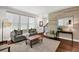 Stylish living room featuring a decorative wall, hardwood floors, and comfortable seating at 2333 White Oak Se Bnd, Smyrna, GA 30080