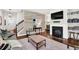 Inviting living room with a fireplace, shiplap wall, and stylish decor at 2333 White Oak Se Bnd, Smyrna, GA 30080