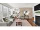 Modern living room featuring a shiplap wall, fireplace, and open staircase at 2333 White Oak Se Bnd, Smyrna, GA 30080