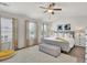 Well-lit main bedroom boasts a plush rug, neutral tones, and stylish window treatments, creating a serene atmosphere at 2333 White Oak Se Bnd, Smyrna, GA 30080