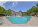 Community pool surrounded by lounge chairs and greenery, perfect for relaxation and recreation at 2333 White Oak Se Bnd, Smyrna, GA 30080