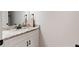 Bright bathroom featuring a modern vanity with a marble countertop and bronze fixtures at 3455 Henderson Dr, Cumming, GA 30041