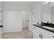 Well-lit bathroom with elegant shiplap accent wall, modern vanity and tile floors at 3455 Henderson Dr, Cumming, GA 30041