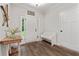 Welcoming foyer with a bench and console table that leads into the home at 3455 Henderson Dr, Cumming, GA 30041