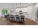 Modern kitchen with white cabinets, stainless steel appliances, and an island with bar seating at 3455 Henderson Dr, Cumming, GA 30041