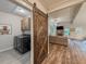 Stylish living space featuring a barn door, neutral tones, and an open layout at 3455 Henderson Dr, Cumming, GA 30041