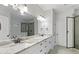 Main bathroom featuring a double vanity, white cabinetry, stone countertops, and an open glass shower at 3455 Henderson Dr, Cumming, GA 30041