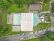 Aerial view of neighborhood pool and clubhouse with parking and green space at 4601 Tall Pines Nw Dr, Atlanta, GA 30327
