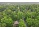 A house and pool, surrounded by dense green trees at 4601 Tall Pines Nw Dr, Atlanta, GA 30327