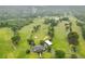 Scenic aerial of golf course with lush green fairways, mature trees, and water features offering a challenging and picturesque experience at 4601 Tall Pines Nw Dr, Atlanta, GA 30327