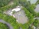 Overhead shot of an outdoor amphitheater featuring tiered seating and a central stage, nestled among mature trees and green space at 4601 Tall Pines Nw Dr, Atlanta, GA 30327
