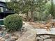 Backyard with a stone path leading to lounge seating near the pool at 4601 Tall Pines Nw Dr, Atlanta, GA 30327