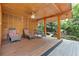 Backyard patio featuring outdoor lounge chairs, a ceiling fan, and lush greenery in the background at 4601 Tall Pines Nw Dr, Atlanta, GA 30327