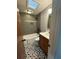 Updated bathroom featuring a tub-shower combo and stylish tile floors at 4601 Tall Pines Nw Dr, Atlanta, GA 30327