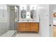 Modern bathroom featuring a glass-enclosed shower, double vanity, and stylish fixtures at 4601 Tall Pines Nw Dr, Atlanta, GA 30327