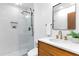 Modern bathroom with a glass shower, contemporary fixtures, and bright white tiling at 4601 Tall Pines Nw Dr, Atlanta, GA 30327