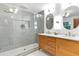 Modern bathroom featuring a double sink vanity, decorative tiling, and a walk-in shower at 4601 Tall Pines Nw Dr, Atlanta, GA 30327