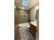Bathroom with tub/shower, skylight, and stylish patterned tile flooring at 4601 Tall Pines Nw Dr, Atlanta, GA 30327