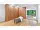 Spacious bedroom with custom wood closet and a bench, and bright natural light at 4601 Tall Pines Nw Dr, Atlanta, GA 30327