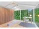 Bright bedroom with custom wood closet and views of trees at 4601 Tall Pines Nw Dr, Atlanta, GA 30327