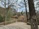 Spacious wooden deck surrounded by lush greenery, offering a serene outdoor living space at 4601 Tall Pines Nw Dr, Atlanta, GA 30327