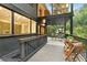 Inviting covered deck with outdoor seating and dining, offering tranquil views of the lush backyard at 4601 Tall Pines Nw Dr, Atlanta, GA 30327