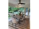 Sunlit dining room with a large wooden table and view of the outdoor greenery at 4601 Tall Pines Nw Dr, Atlanta, GA 30327