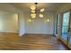 Bright dining room with chandelier lighting and door leading to a deck at 4601 Tall Pines Nw Dr, Atlanta, GA 30327