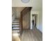 Inviting entryway with modern staircase and sleek hardwood floors at 4601 Tall Pines Nw Dr, Atlanta, GA 30327