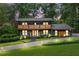 Stunning two-story home with modern design, a front yard and a walkway at 4601 Tall Pines Nw Dr, Atlanta, GA 30327