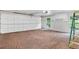 Spacious garage with a brick floor and access to the exterior at 4601 Tall Pines Nw Dr, Atlanta, GA 30327