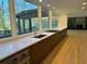 Bright kitchen with an island cooktop, views of the backyard, and stainless-steel appliances at 4601 Tall Pines Nw Dr, Atlanta, GA 30327
