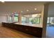 Bright kitchen featuring stainless steel appliances, wood cabinets, and large windows at 4601 Tall Pines Nw Dr, Atlanta, GA 30327