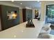 Modern kitchen with quartz counters, sleek cabinets, and bar stool seating at 4601 Tall Pines Nw Dr, Atlanta, GA 30327