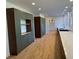 Sleek kitchen with stainless appliances, custom cabinets, and hardwood flooring at 4601 Tall Pines Nw Dr, Atlanta, GA 30327