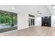 Spacious living room boasts a brick fireplace, sliding glass doors to backyard, and hardwood floors at 4601 Tall Pines Nw Dr, Atlanta, GA 30327