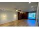Spacious living room with hardwood floors, a ceiling fan, pendant lighting, and built-in wooden cabinets at 4601 Tall Pines Nw Dr, Atlanta, GA 30327