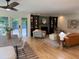 Open-concept living space featuring built-in bookshelves and views of the stone pool at 4601 Tall Pines Nw Dr, Atlanta, GA 30327