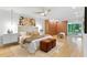 Bright and spacious main bedroom with hardwood floors, a ceiling fan and backyard view at 4601 Tall Pines Nw Dr, Atlanta, GA 30327